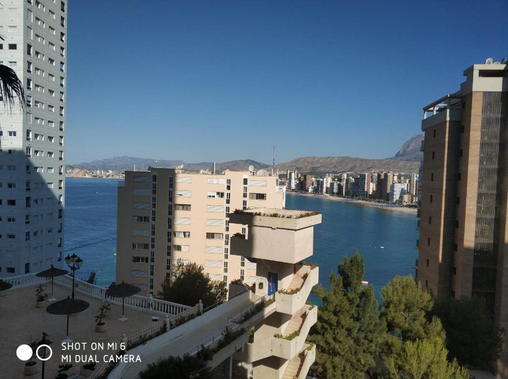 a view of a city with a river and buildings at Apartament Trinisol ll with sea view in Benidorm