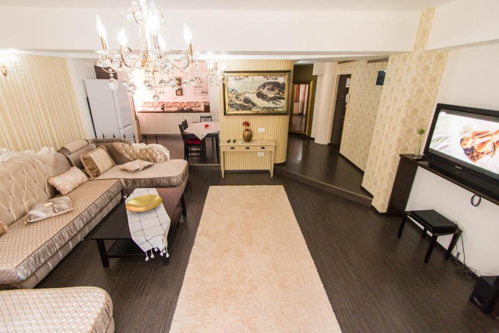 Kuchyň nebo kuchyňský kout v ubytování Hotel Jolie Apartments