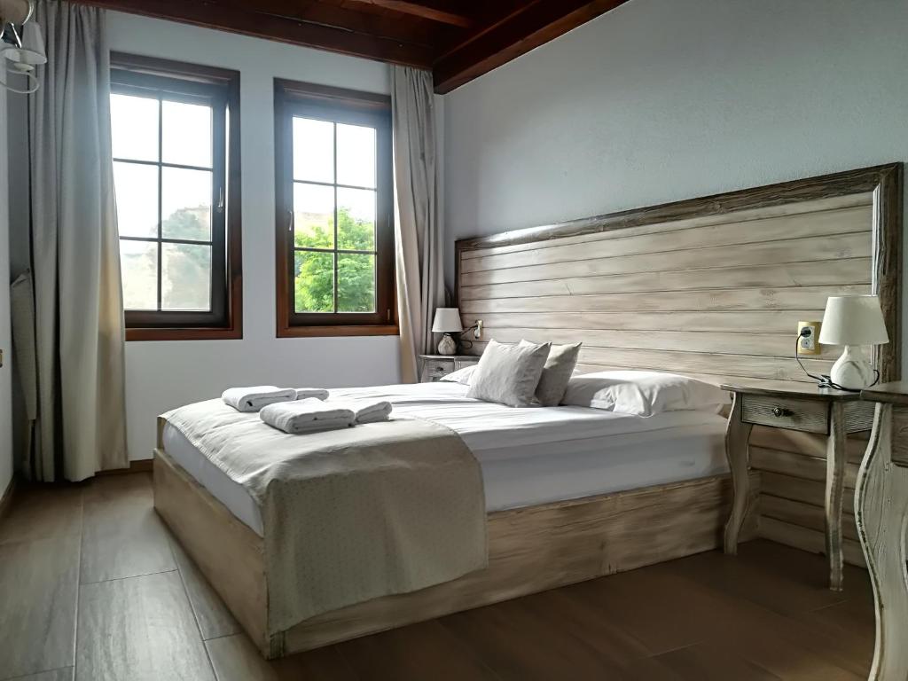 Postel nebo postele na pokoji v ubytování Manoleva House
