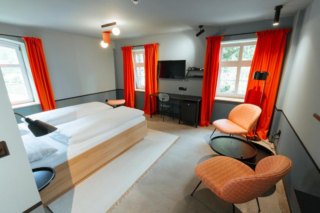 Postel nebo postele na pokoji v ubytování Hotel am Kloster - Domäne Möllenbeck