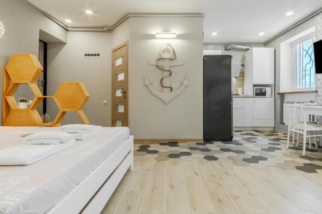 a room with two beds and a kitchen at VIP apartment Blue Whale in Odesa