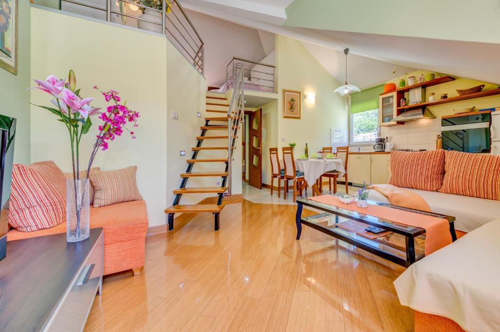 a living room with a couch and a table at Natali in Omiš