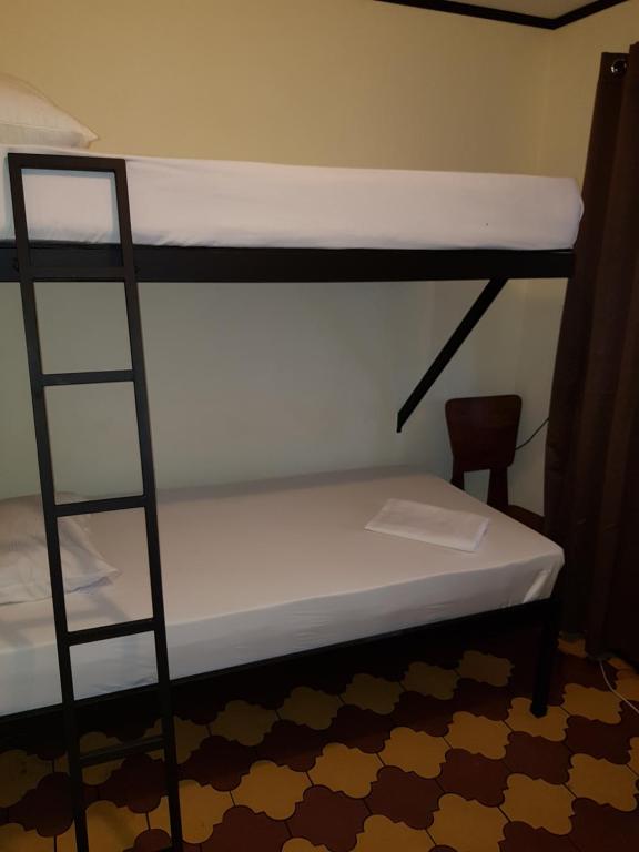 Postel nebo postele na pokoji v ubytování Hostel Dodero