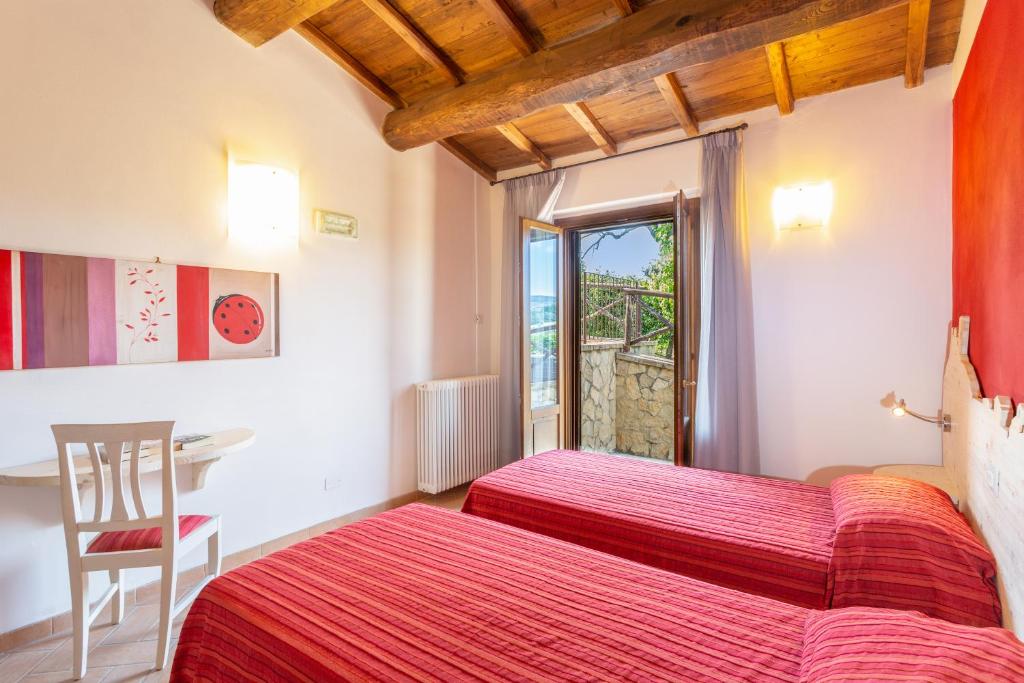 Postel nebo postele na pokoji v ubytování Agriturismo Dei Casali