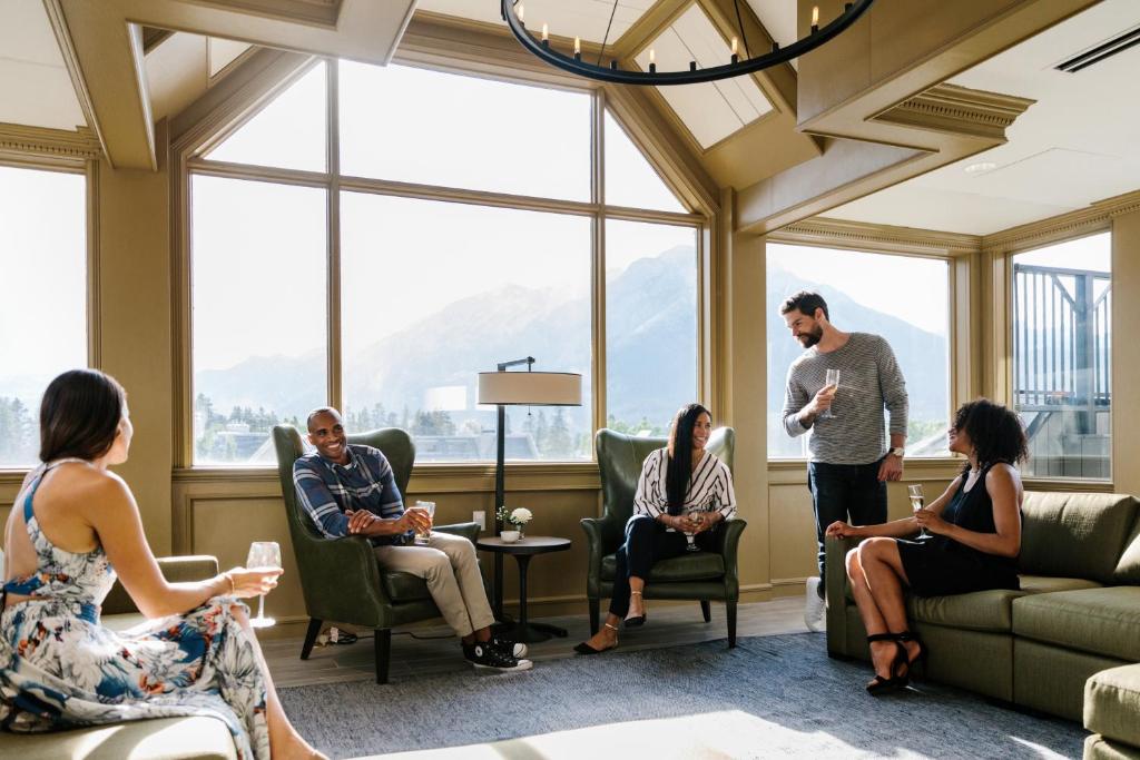 a group of people sitting in a waiting room at Mount Royal Hotel in Banff