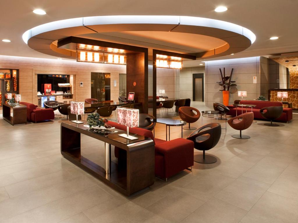 a lobby with couches and chairs in a building at THotel Lamezia in Lamezia Terme
