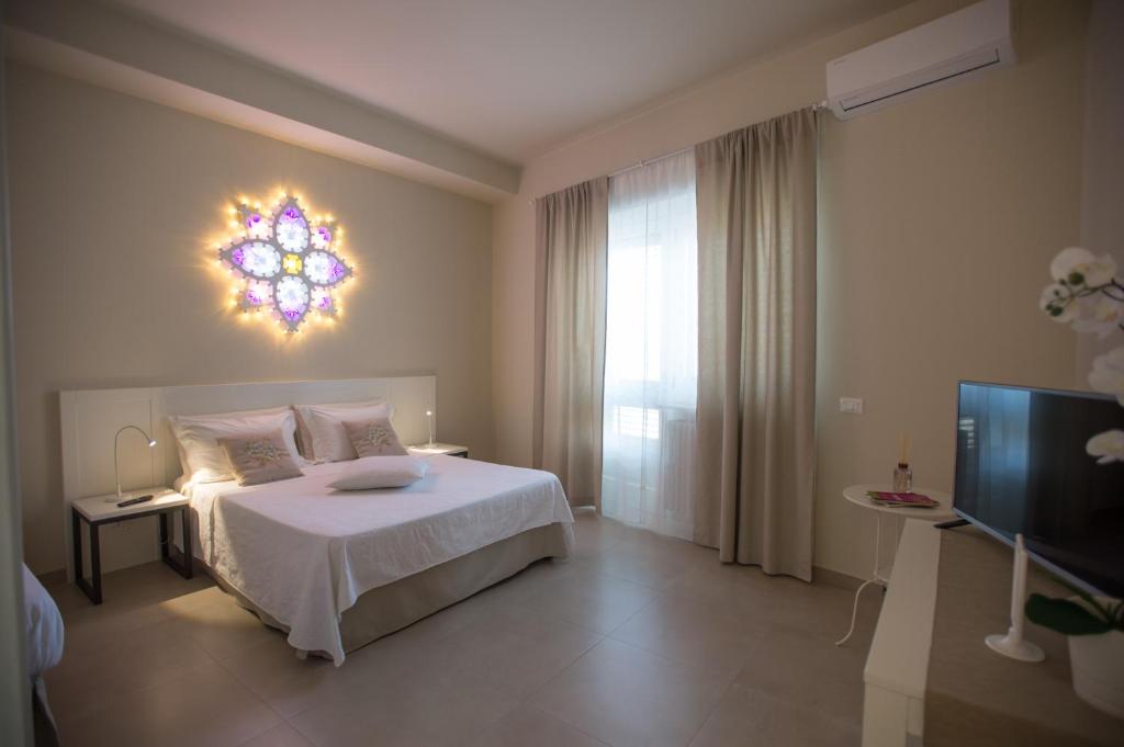 Posteľ alebo postele v izbe v ubytovaní Luci del Salento Guest House