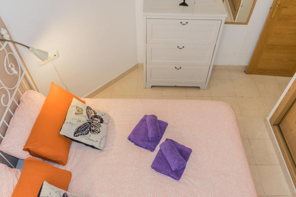 Posteľ alebo postele v izbe v ubytovaní MALAMA Apartamentos Turísticos