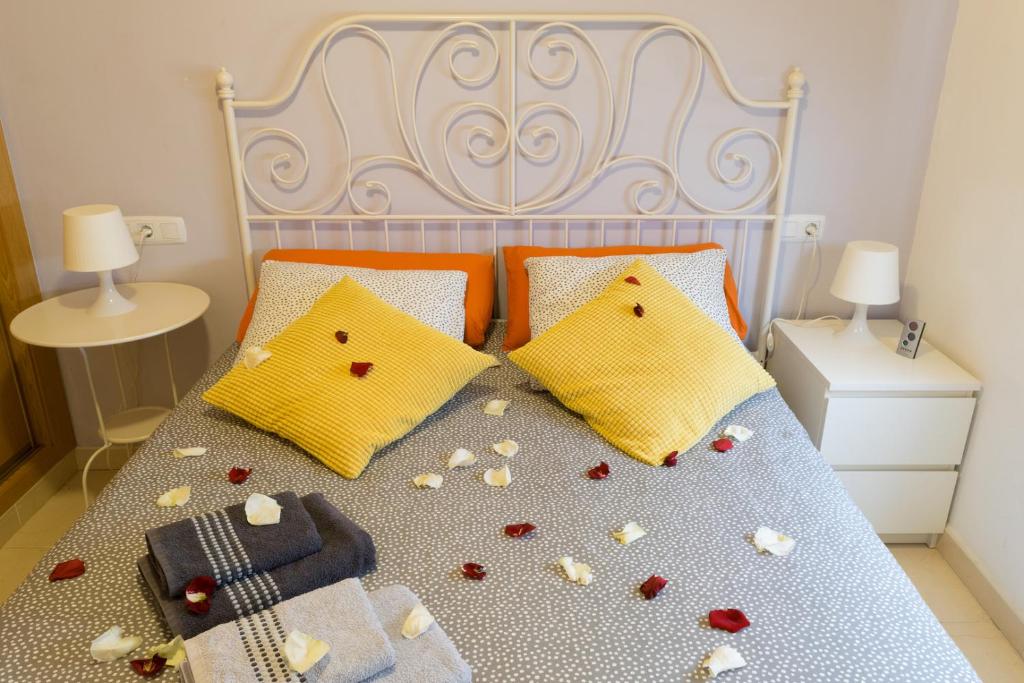 Posteľ alebo postele v izbe v ubytovaní MALAMA Apartamentos Turísticos