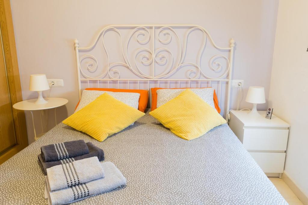 Posteľ alebo postele v izbe v ubytovaní MALAMA Apartamentos Turísticos