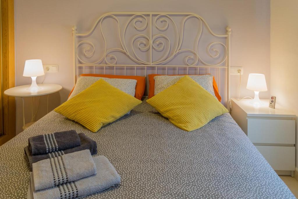 Posteľ alebo postele v izbe v ubytovaní MALAMA Apartamentos Turísticos