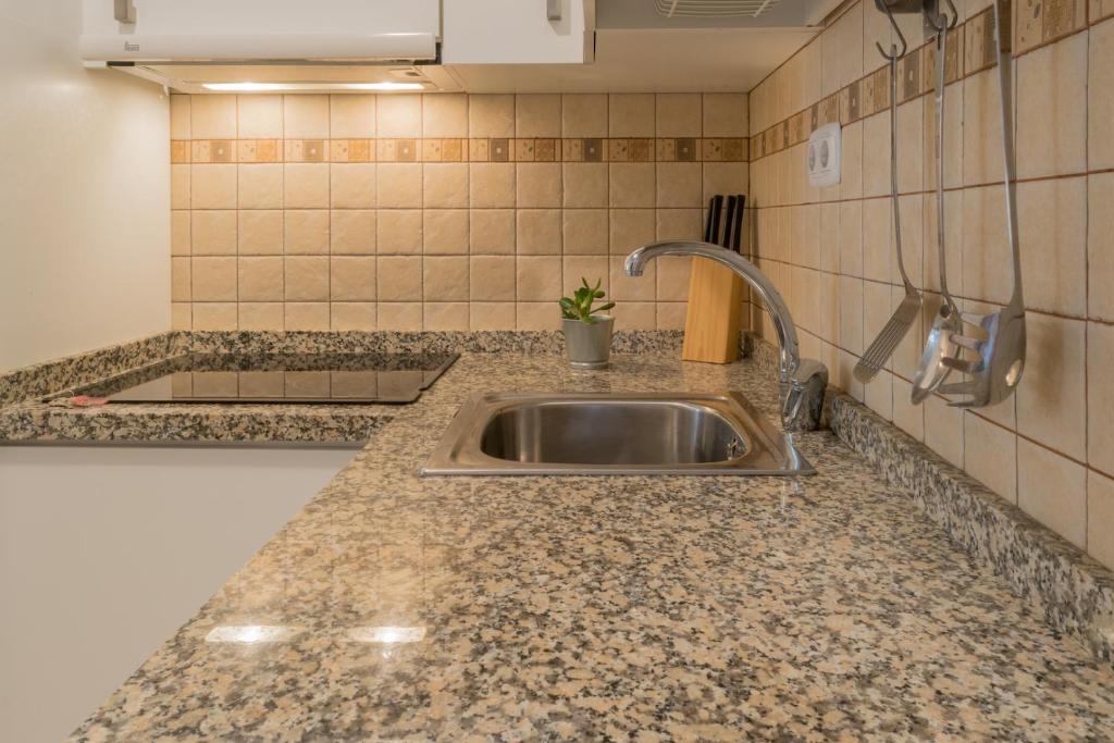 Kuchyňa alebo kuchynka v ubytovaní MALAMA Apartamentos Turísticos