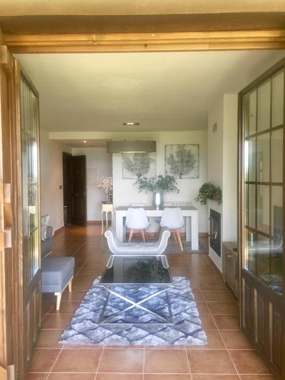 a living room with a couch and a table at Badaguas It's Cozy in Badaguás