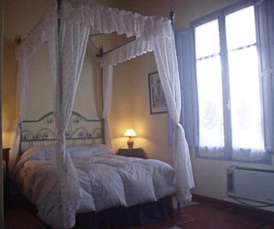 Postel nebo postele na pokoji v ubytování Posada del Angel