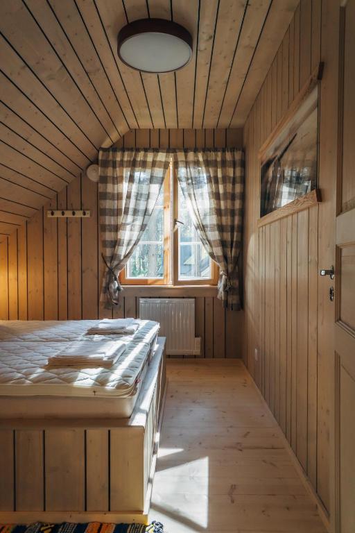 Postel nebo postele na pokoji v ubytování Peipsi Homestay