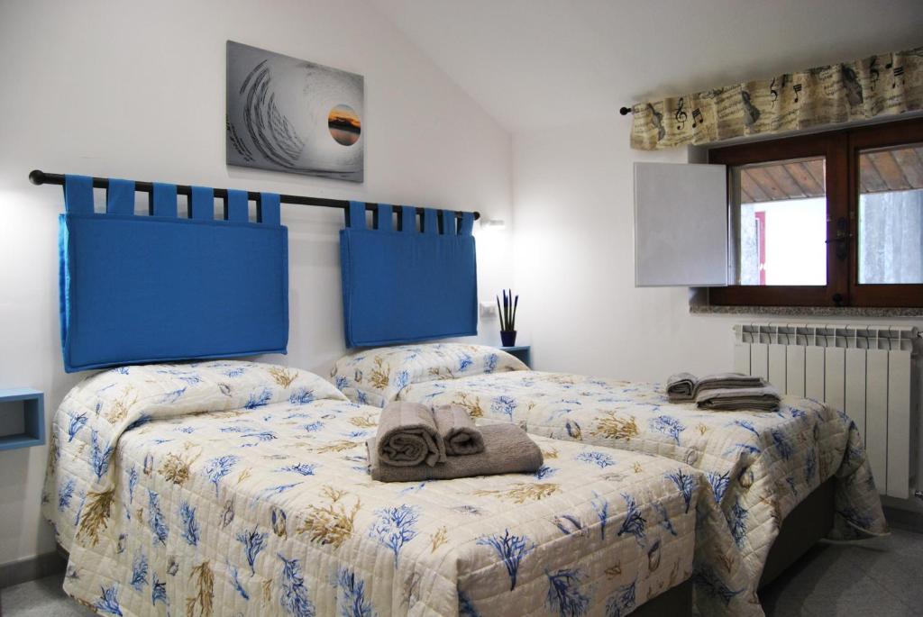 Кровать или кровати в номере Jazz & Blues Apartments near " Sentiero degli Dei "