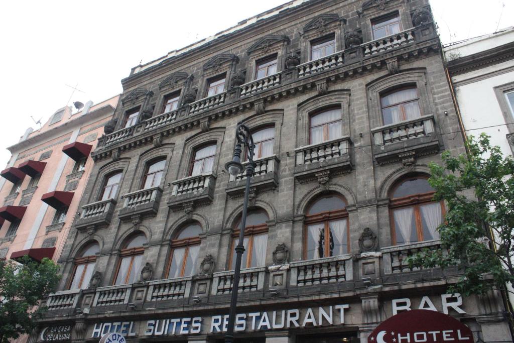 a large building with balconies on the side of it at Casa de la Luna in Mexico City