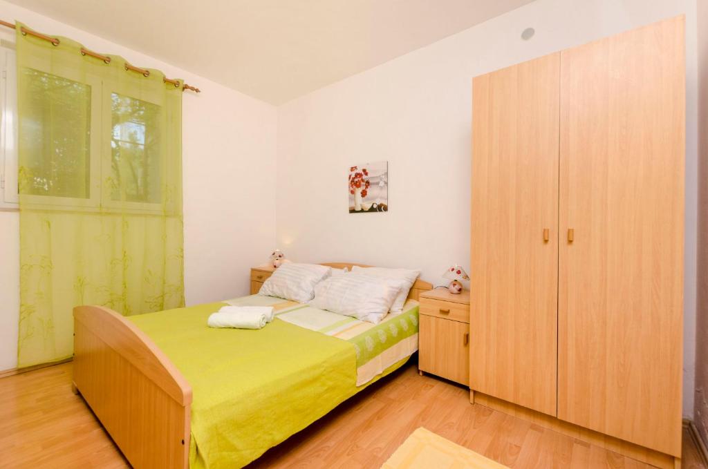 Postel nebo postele na pokoji v ubytování Apartments Helena