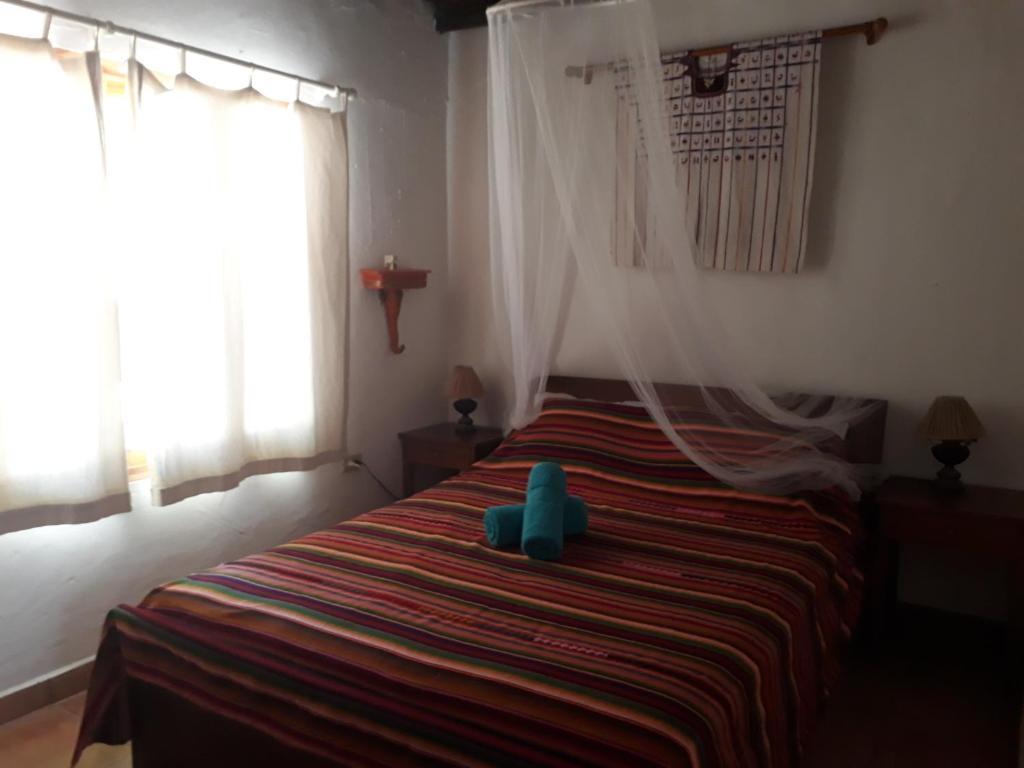 Postel nebo postele na pokoji v ubytování Bed & Breakfast T.T