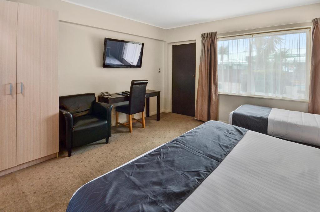 Postel nebo postele na pokoji v ubytování Poenamo Hotel