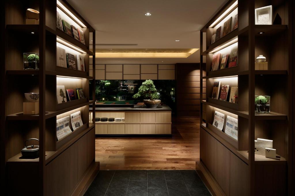 a hallway with a fish tank in the background at Grand Prince Hotel Takanawa in Tokyo
