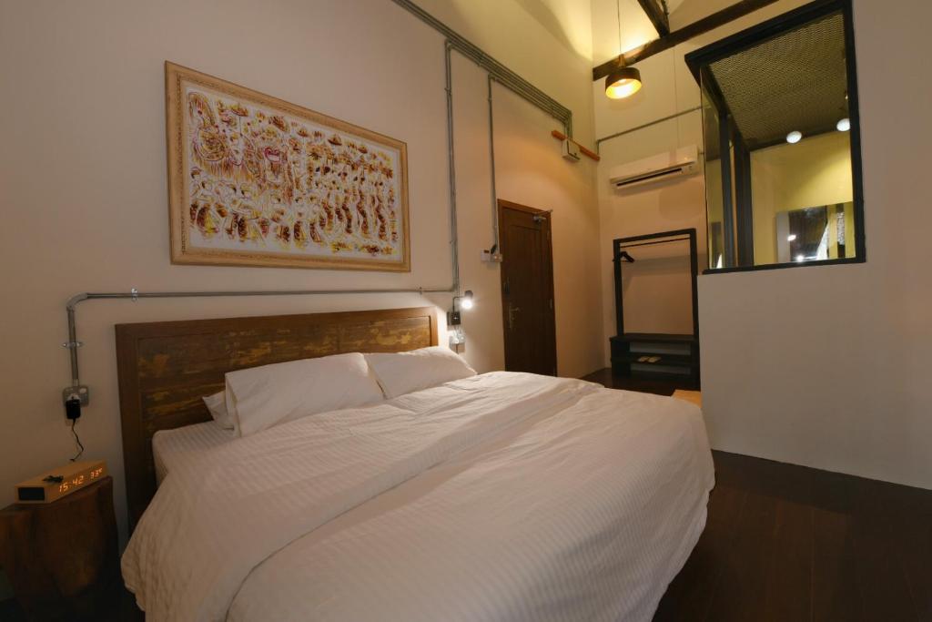 Postel nebo postele na pokoji v ubytování 38PC Boutique Hotel