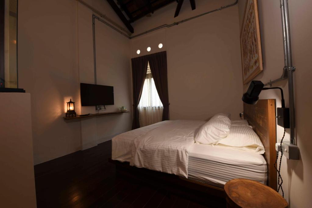 Postel nebo postele na pokoji v ubytování 38PC Boutique Hotel