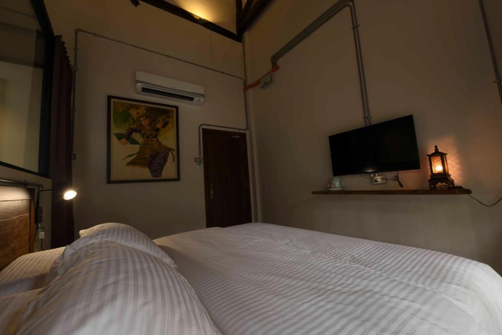 Postel nebo postele na pokoji v ubytování 38PC Boutique Hotel