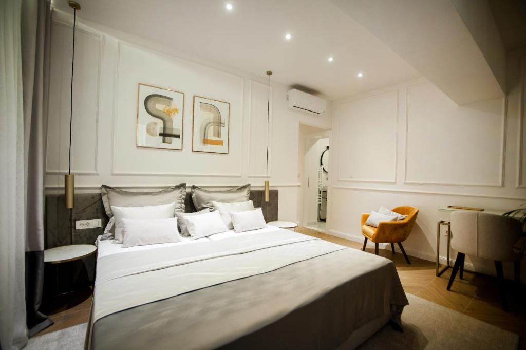 Postel nebo postele na pokoji v ubytování Club 5 boutique rooms
