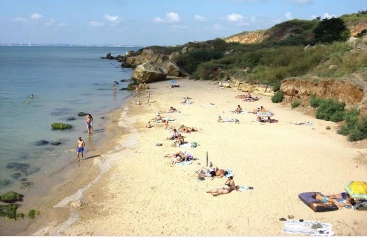 a group of people laying on a beach at Fontanka Apartment in Fontanka