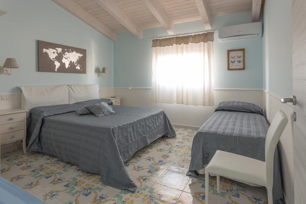 Katil atau katil-katil dalam bilik di La Casetta in villa