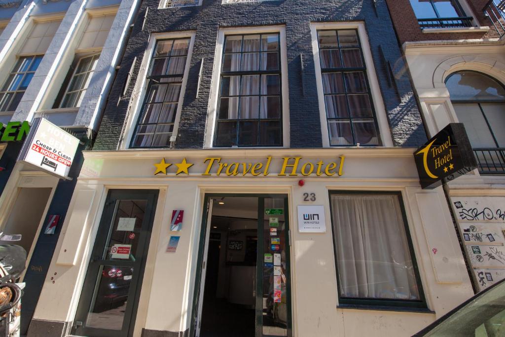 a travel hotel building with a travel hotel sign on it at Travel Hotel Amsterdam in Amsterdam