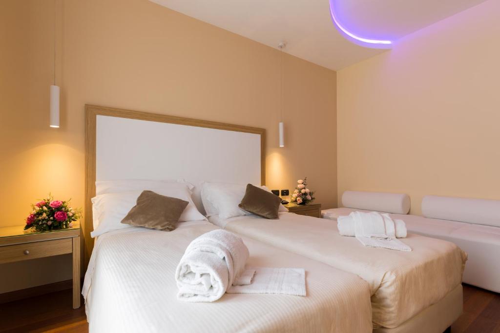 Postel nebo postele na pokoji v ubytování Hotel Villa Esperia