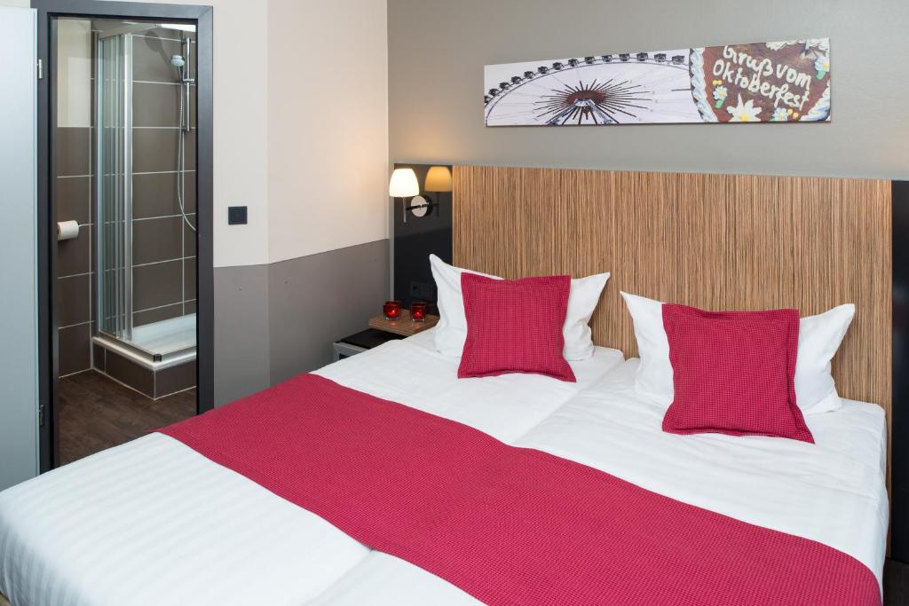 Postel nebo postele na pokoji v ubytování Hotel Munich City