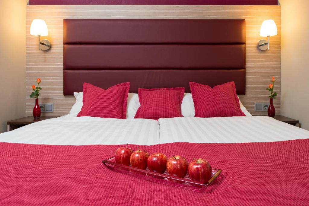 Postel nebo postele na pokoji v ubytování Hotel Munich City