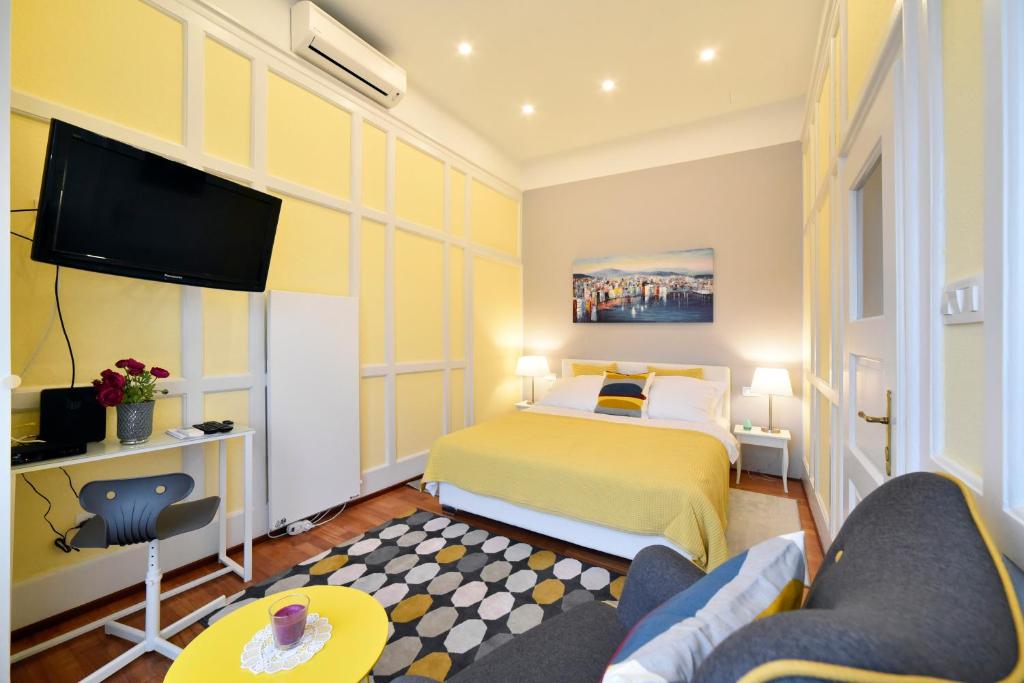 Postel nebo postele na pokoji v ubytování Favourite Apartments