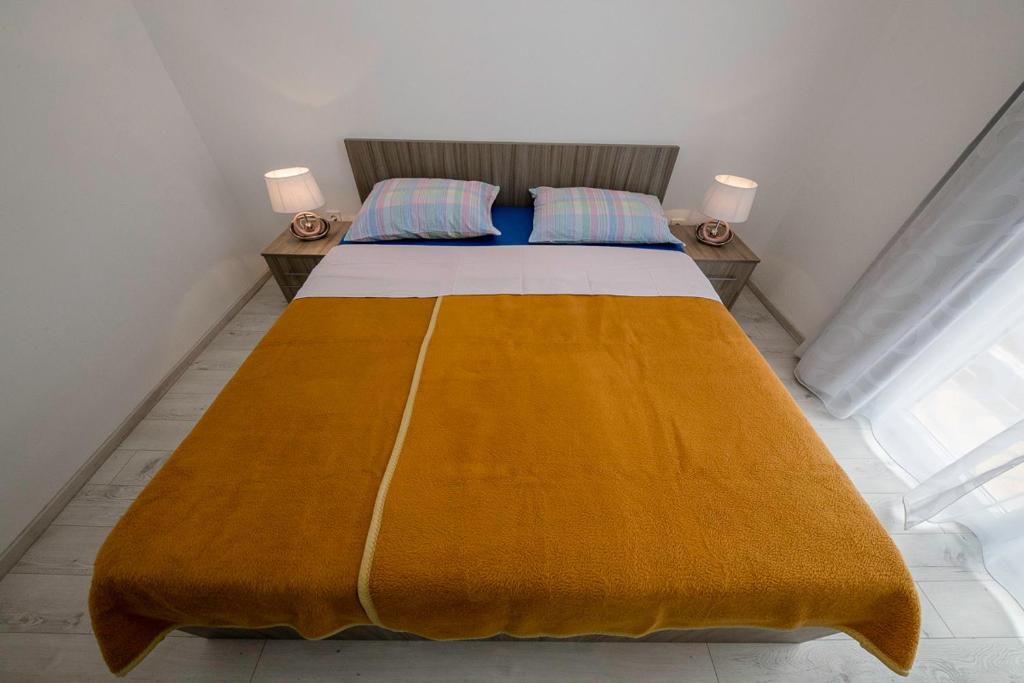Posteľ alebo postele v izbe v ubytovaní Apartman Jasmina