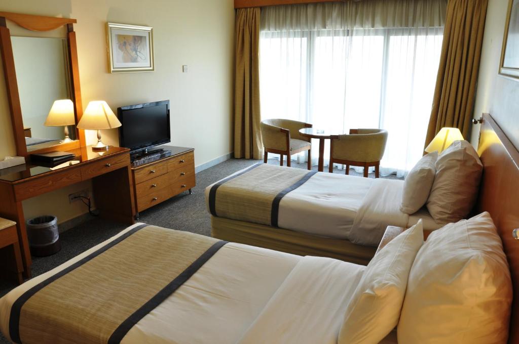 TV a/nebo společenská místnost v ubytování Lavender Hotel Deira