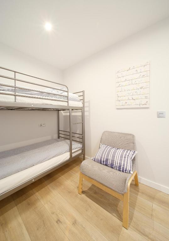 A bed or beds in a room at Apartamento Centro-Playa II