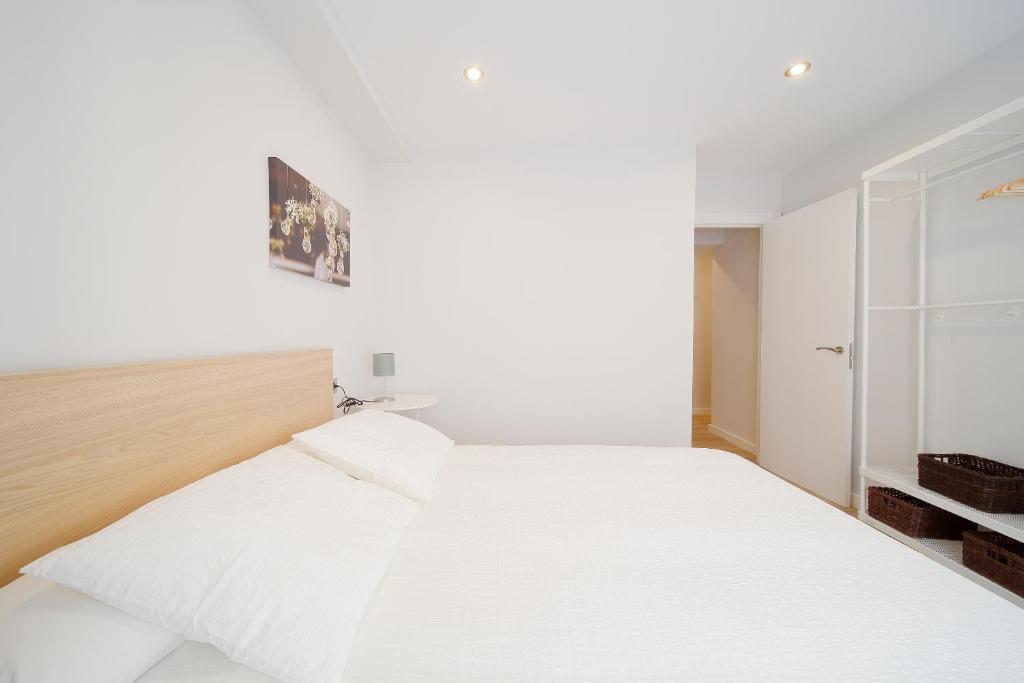 A bed or beds in a room at Apartamento Centro-Playa II