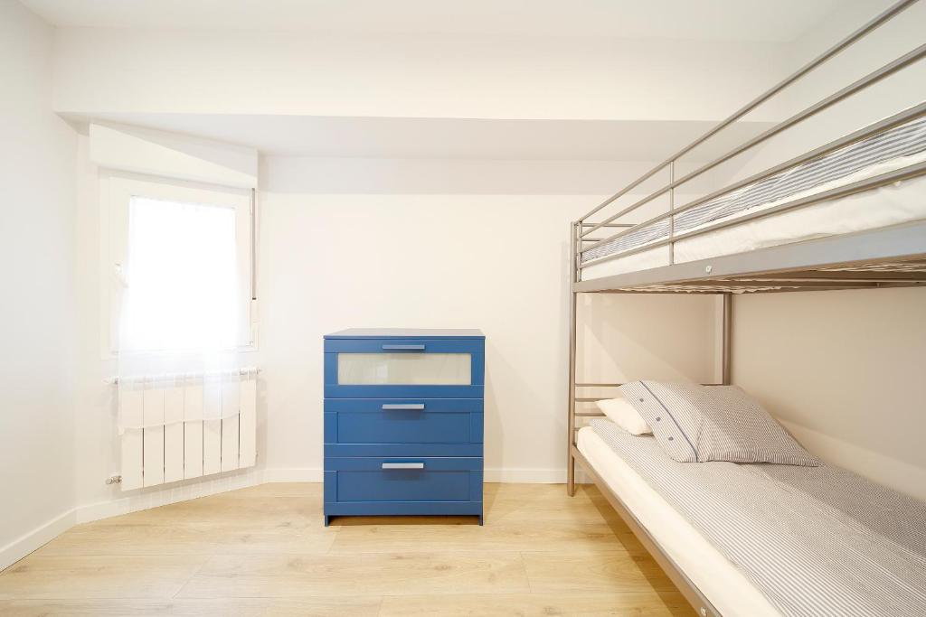 A bed or beds in a room at Apartamento Centro-Playa II