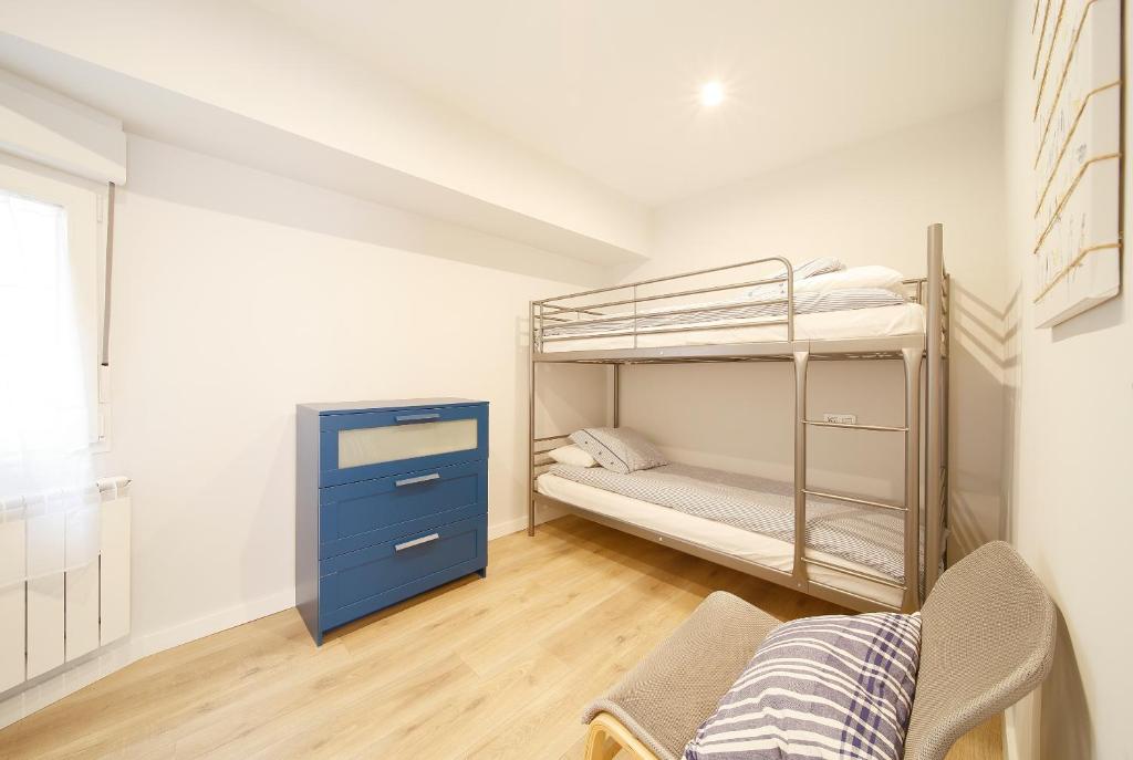 A bed or beds in a room at Apartamento Centro-Playa II