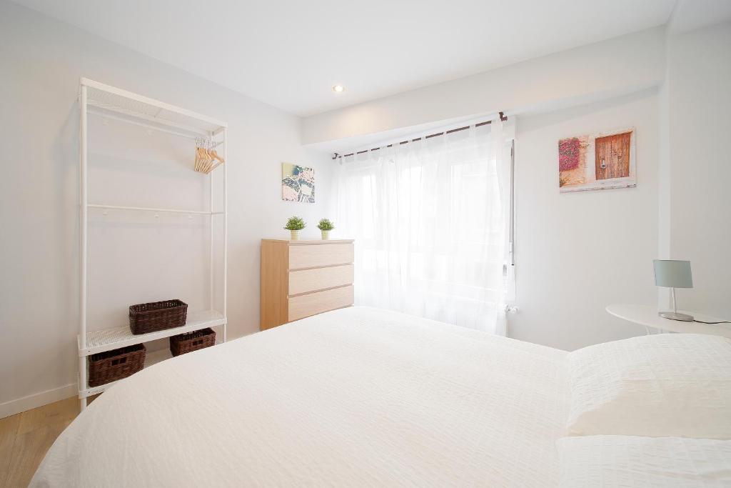 A bed or beds in a room at Apartamento Centro-Playa II