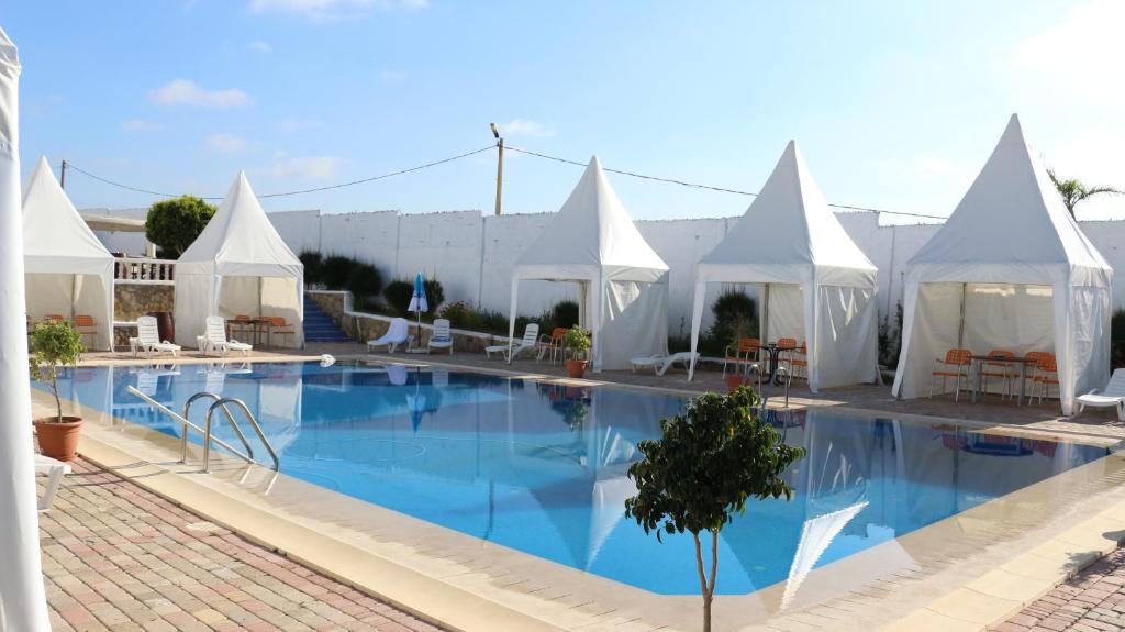 Bazén v ubytování Tanger Med Hotel, Conference & Catering nebo v jeho okolí