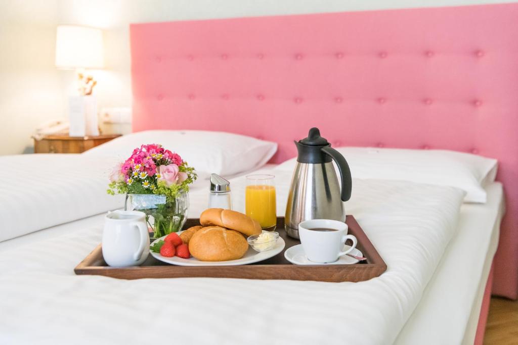 Łóżko lub łóżka w pokoju w obiekcie Hotel Regina