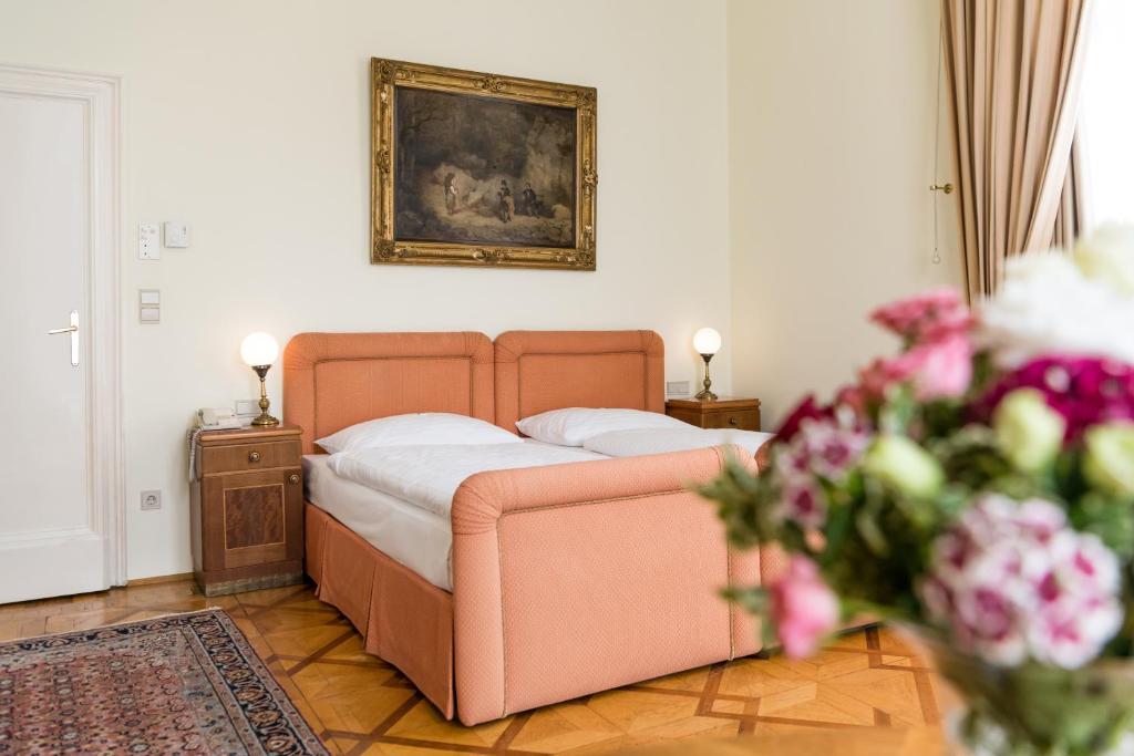 Łóżko lub łóżka w pokoju w obiekcie Hotel Regina