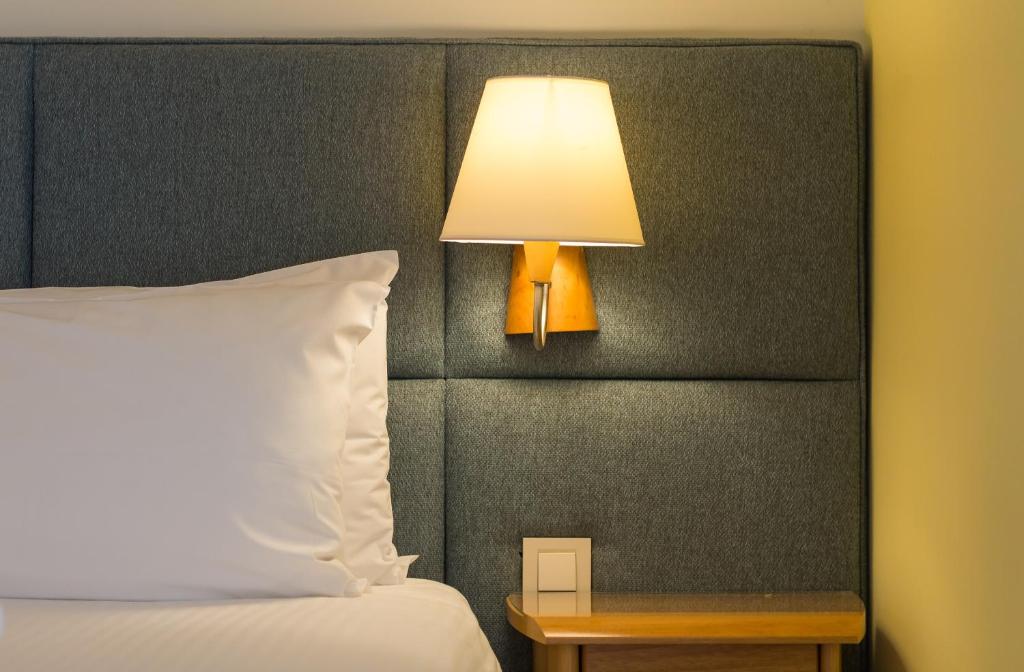 Postel nebo postele na pokoji v ubytování Tropical Hotel