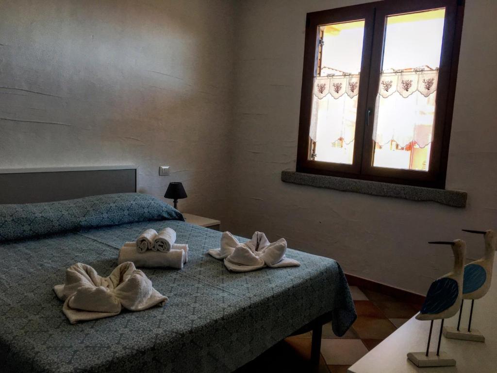 Postel nebo postele na pokoji v ubytování Il Blu Tanca Piras