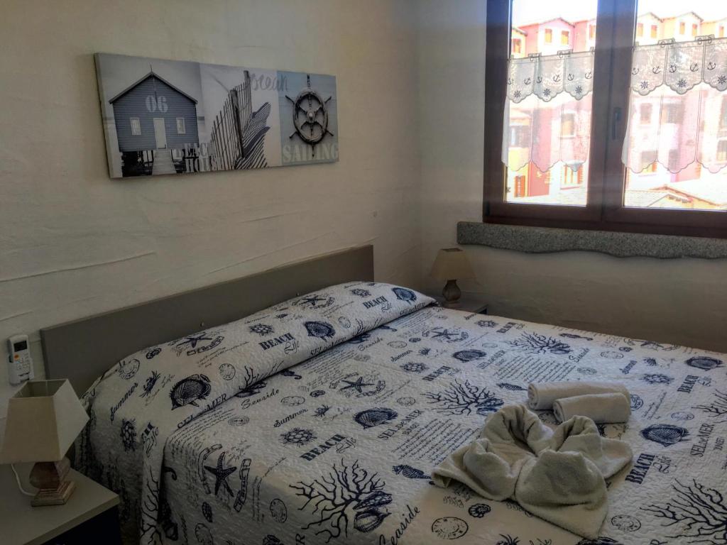 Postel nebo postele na pokoji v ubytování Il Blu Tanca Piras