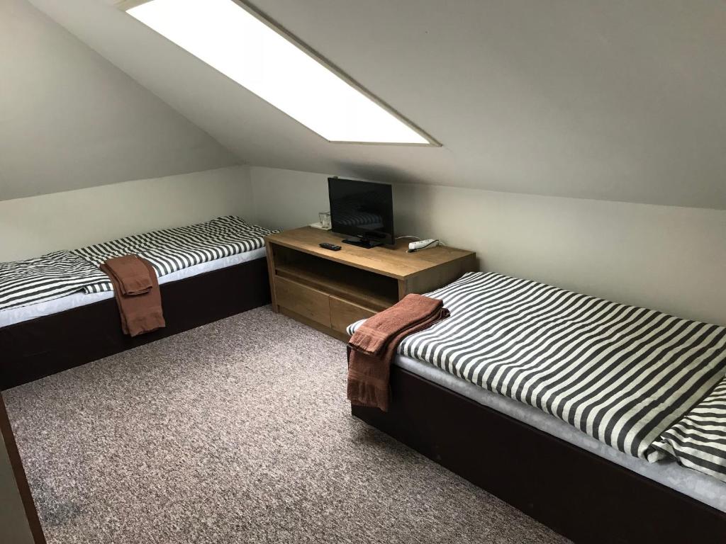 Postel nebo postele na pokoji v ubytování Penzion Ema B&B
